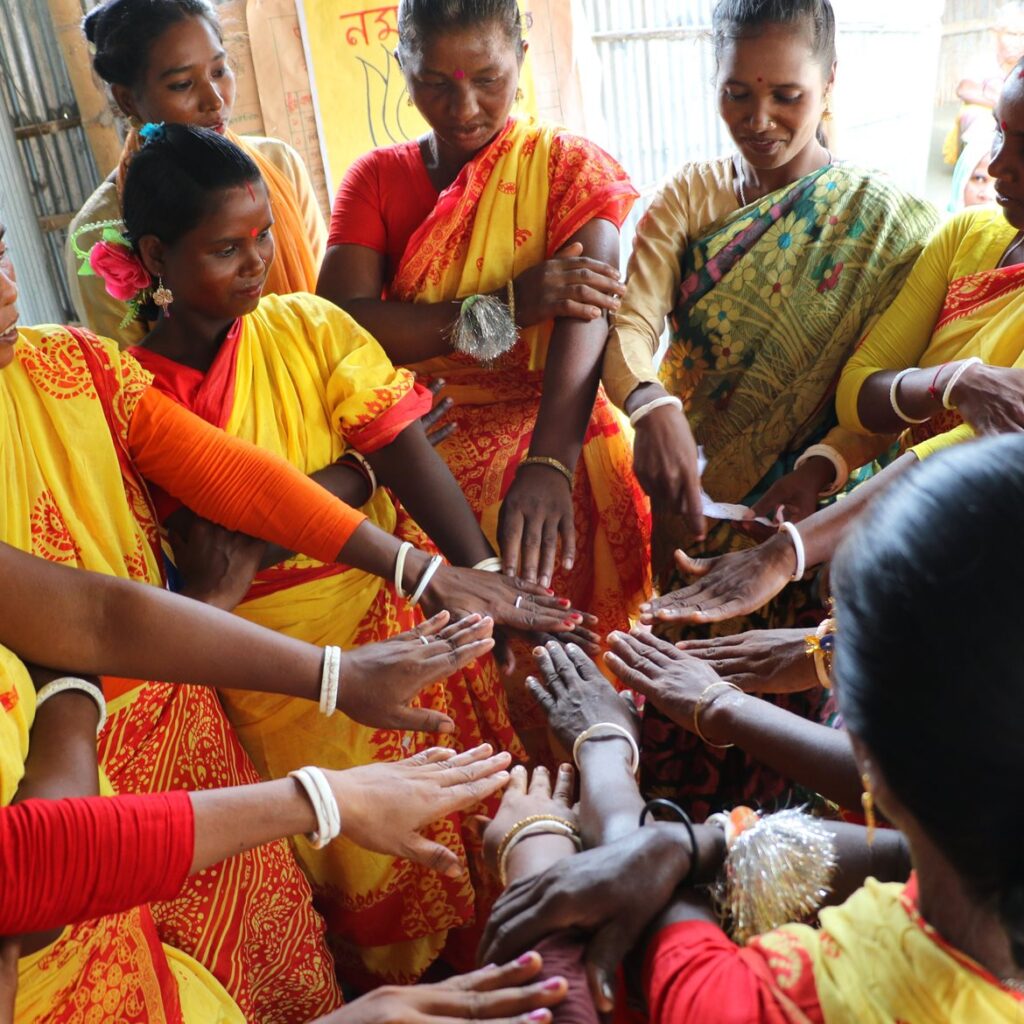 Group of women wearing colourful dresses